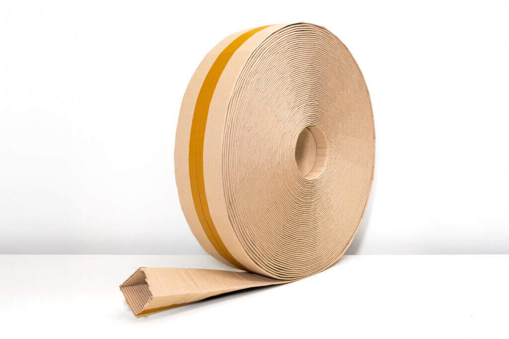 A roll of flat cardboard tubing